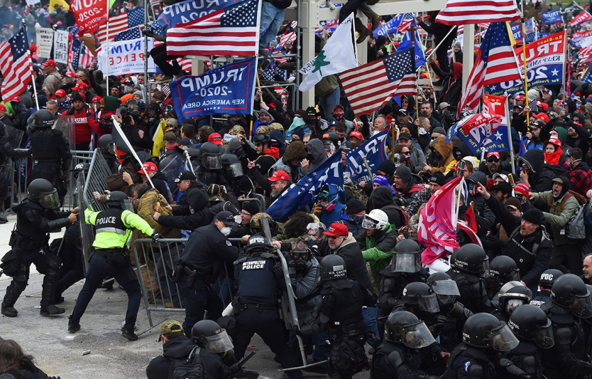 President Trump supporters clash with police and security forces as they push barricades to storm the U.S. Capitol in Washington, D.C., on January 6, 2021. Demonstrators breached security and entered the Capitol as Congress debated the 2020 presidential election Electoral Vote Certification.
