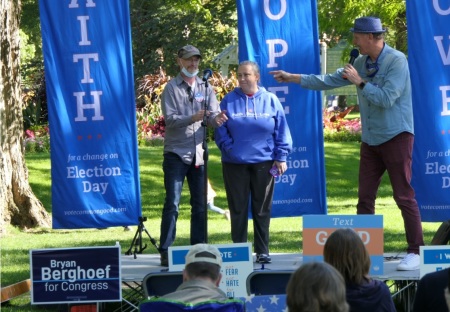 Vote Common Good leader Doug Pagitt, a Minnesota pastor, speaks with 2016 Donald Trump voter Ronald Hawthorne and his wife at a rally in Michigan ahead of the 2020 presidential election.
