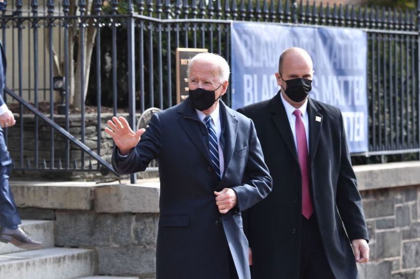 US President Joe Biden(C) leaves Holy Trinity Catholic Church in the Georgetown neighborhood of Washington,DC on January 24, 2021.