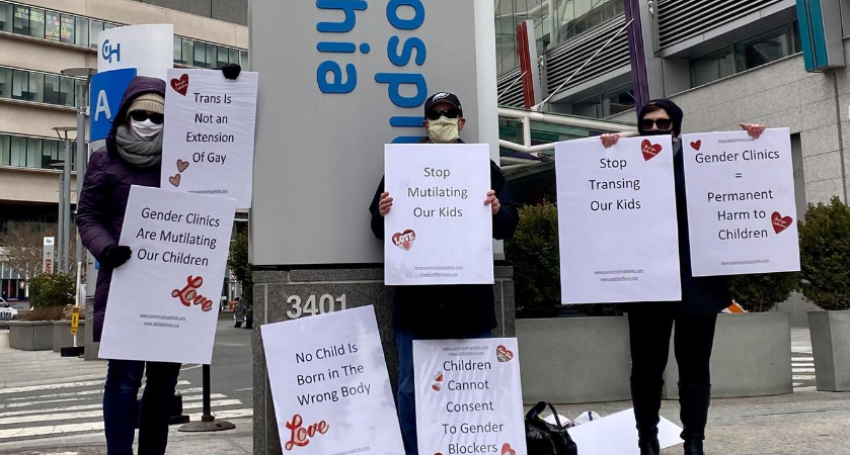 Parents protest outside Children's Hospital in Philadelphia, Pa., on Feb. 14, 2021.