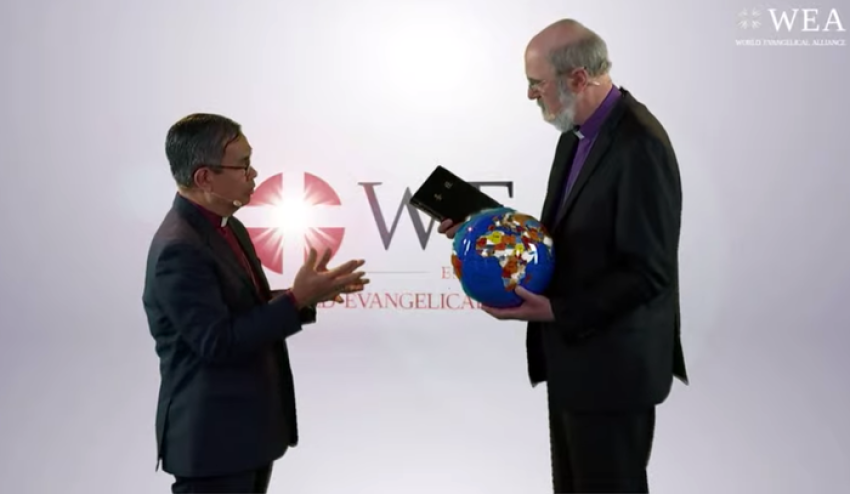 Outgoing Secretary-General Bishopp Efraim Tendero (left) hands over a globe and a Bible to incoming Secretary-General Bishop Thomas Schirrmacher during a handover ceremony in Bonn, Germany on Feb. 27, 2020.
