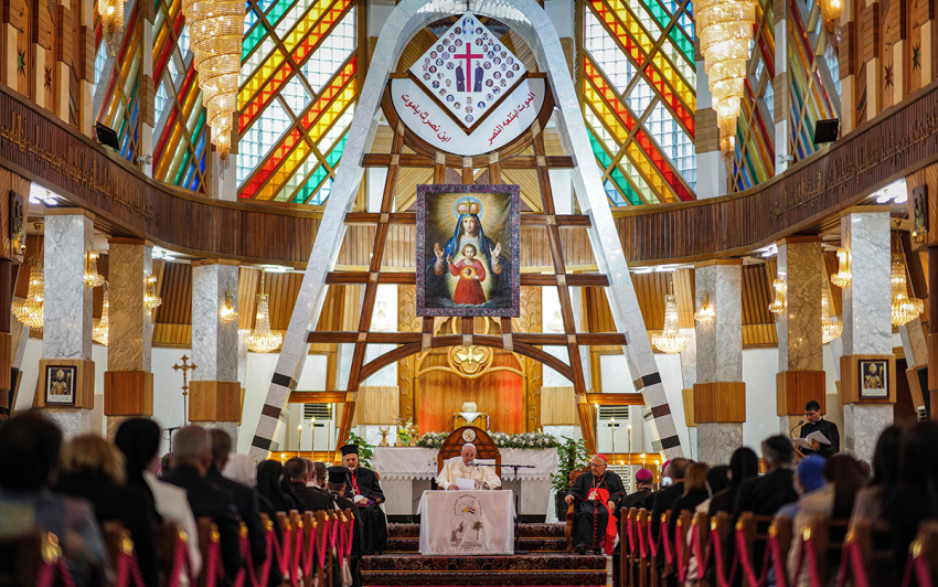 Pope Francis (C) delivers a sermon at the Syriac Catholic Cathedral of Our Lady of Salvation (Sayidat al-Najat) in Baghdad at the start of the first ever papal visit to Iraq on March 5, 2021, accompanied by Cardinal Louis Raphael I Sako (C-R), Patriarch of Babylon of the Chaldeans and head of the Chaldean Catholic Church, and Ignatius Joseph III Yunan (C-L), Syriac Catholic Patriarch of Antioch and all the East of the Syriacs. - In an address to the faithful in Baghdad, Pope Francis expressed his gratitude to his fellow clergy for supporting Iraq's Christians, whose population has dwindled due to conflict. 