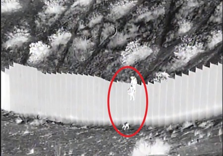 U.S. Border Patrol agents from the Santa Teresa Station in New Mexico rescue two toddlers dropped over a border barrier on March 30, 2021.