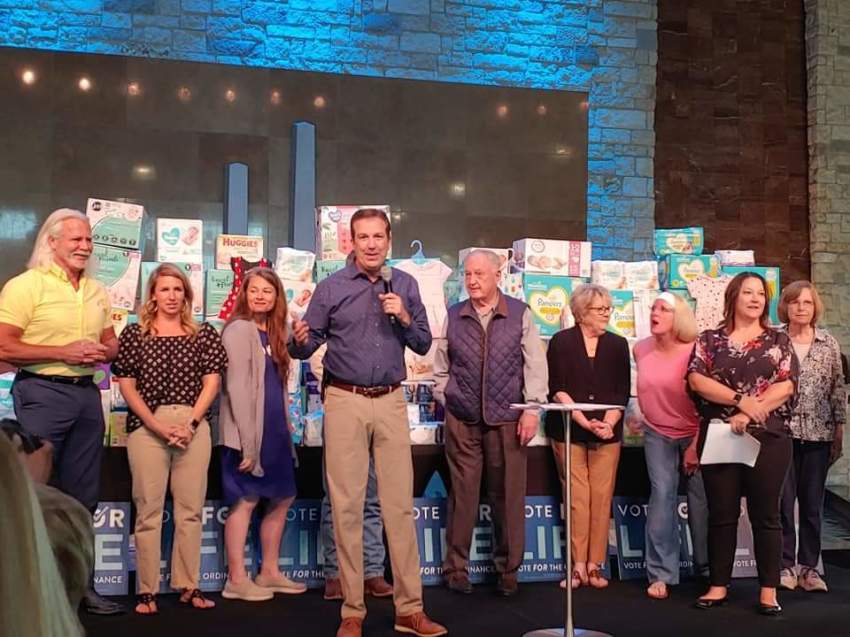 Supporters of the push to make Lubbock, Texas a "sanctuary city for the unborn" gather at a watch party held at Trinity Church in Lubbock, Texas on May 1, 2021.