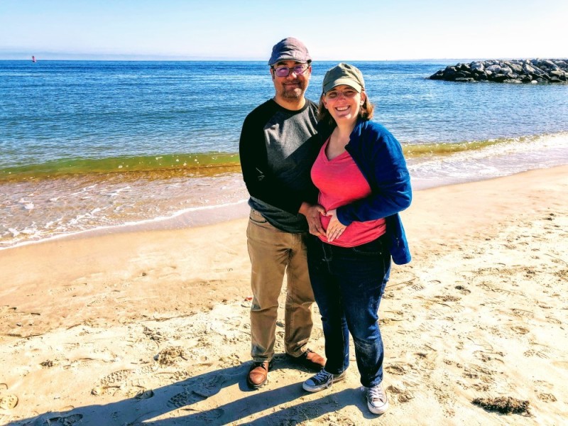 Joy Granados pregnant with baby Mateo Augusto and husband, Vini, at the beach. | Photo Credit: Tia Mireya