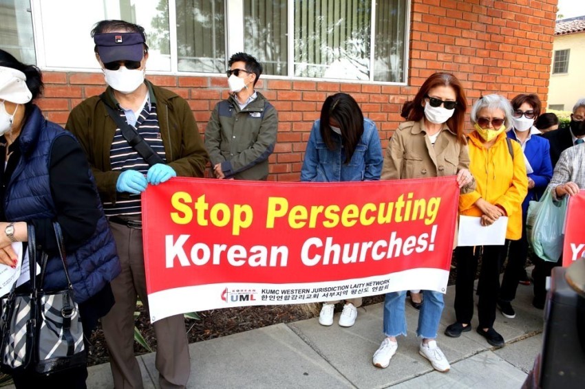 Protestors rally against the reassignment of three Korean pastors in the California-Pacific Conference of the United Methodist Church on May 21, 2021.