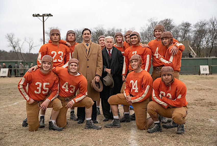 Actors pose for a team photo for the film "12 Mighty Orphans."