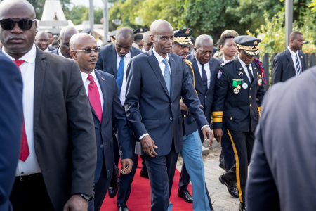 Hatian President Jovenel Moise (C) leaves the MUPANAH (Haitian National Pantheon Museum) to go to a military parade to commemorate Battle of Vertieres Day, the last major battle of the Second War of Haitian Independence, at the Presidential Palace in Port-au-Princeon November 18, 2019.