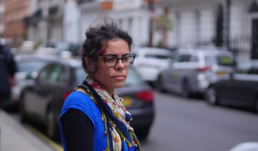 Hatun Tash walks on a London sidewalk.