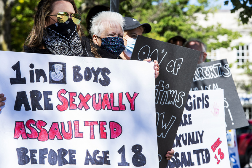 Demonstrators in Keene, New Hampshire, gather at a "Save the Children Rally" to protest child sex trafficking and pedophilia around the world, on September 19, 2020. 