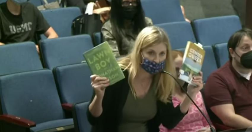 Stacy Langton, the mother of a student at Fairfax High School in Fairfax County, Virginia, reads aloud sexually explicit content from two books distributed in the school district’s libraries at a Fairfax County School Board meeting, Sept. 23, 2021.