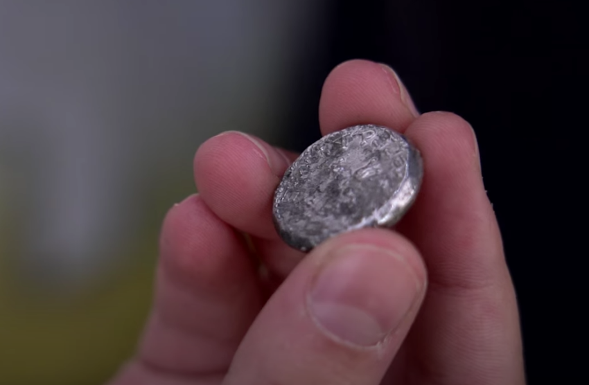 An ancient coin believed to have been printed by Jewish rebels during the First Jewish-Roman War is shown after it was discovered at Emek Tzurim National Park in Jerusalem in November 2021.