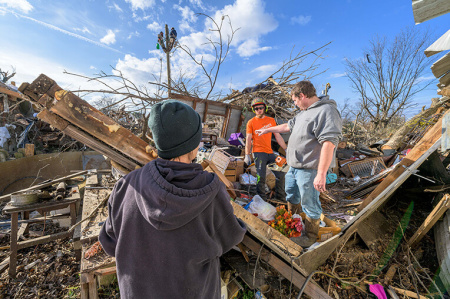 Samaritan's Purse volunteers help homeowner Matt Mill in Trumann, Arkansas after tornadoes struck across six states in December 2021.