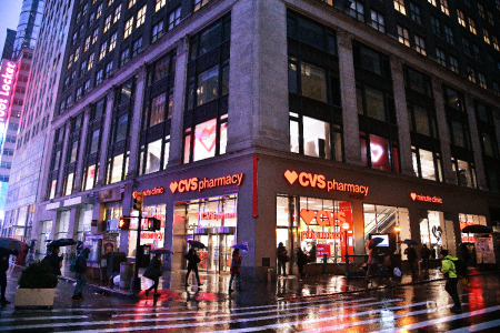 People walk outside of a CVS Pharmacy store in New York City on January 24, 2019.