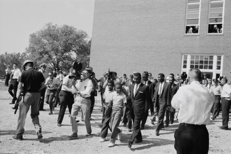 Schoolboys Dwight and Floyd Armstrong arrive at Graymont Elementary School in Birmingham, Alabama, on the first day of desegregation of schools in the city, 4th September 1963. They are accompanied by their father James Armstrong, civil rights campaigner Fred Shuttlesworth and lawyer Oscar Adams.