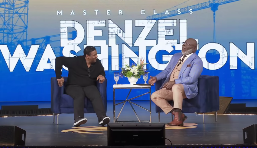 Denzel Washington speaks with Bishop T.D. Jakes at the International Leadership Summit in Charlotte, North Carolina, on April 2, 2022.