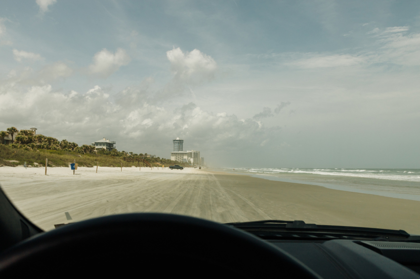 Driving on the 23 miles of white-sand beach in Daytona Beach, Florida.