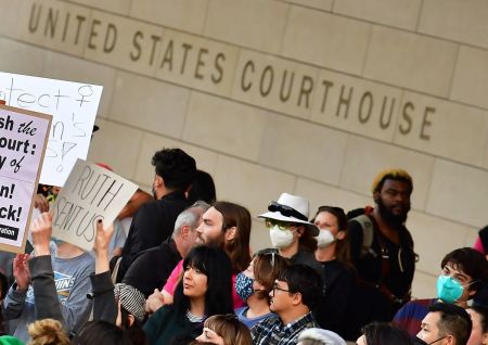 A person holds up a sign reading "Ruth Sent Us" as pro-choice activists gather outside the U.S. Courthouse to defend abortion rights in downtown Los Angeles on May 3, 2022.