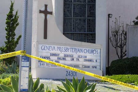 A police yellow tape is seen after a shooting inside Geneva Presbyterian Church in Laguna Woods, California, on May 15, 2022. - One person was dead and four people were "critically" injured in a shooting at a church near Los Angeles, law enforcement said Sunday, just one day after a gunman killed 10 people at a grocery store in New York state.