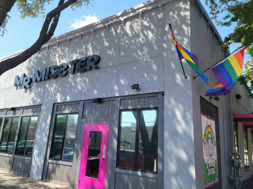 LGBT rainbow flags fly outside Mr. Misster, a gay bar in Dallas, Texas.