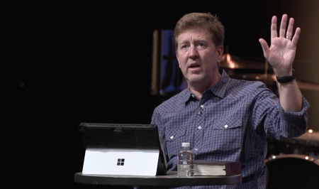 Gary Hamrick, the senior pastor of Cornerstone Chapel in Leesburg, Virginia, answers questions asked by an audience of his congregants on June 8, 2022.