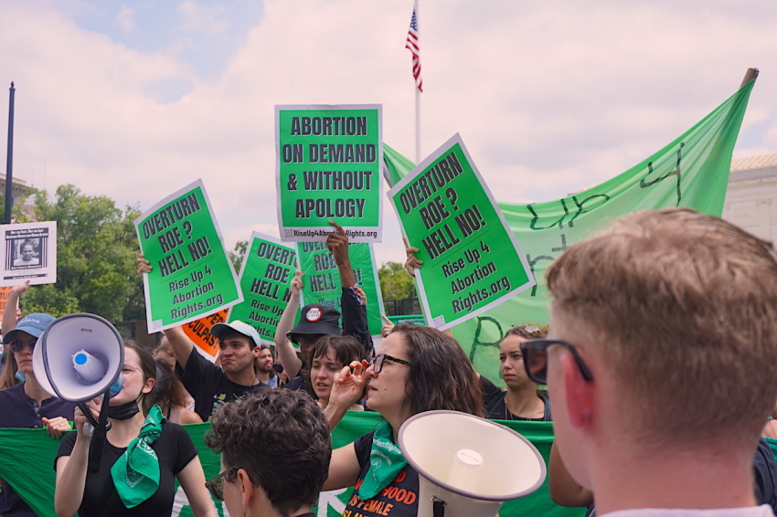 Participants in a rally outside the Supreme Court of the United States in Washington D.C. held signs expressing their stance on abortion following the Dobbs v. Jackson Women's Health Organization decision, June 24, 2022.