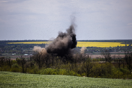 Smoke rises after an explosion during a demining mission by members of a demining team of the State Emergency Service of Ukraine near the village of Hryhorivka, Zaporizhzhia Region, on May 5, 2022, amid the Russian invasion of Ukraine.