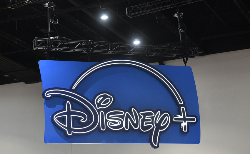 The logo of the Disney+ streaming service hangs above their booth during San Diego Comic-Con International in San Diego, California, on July 24, 2022.