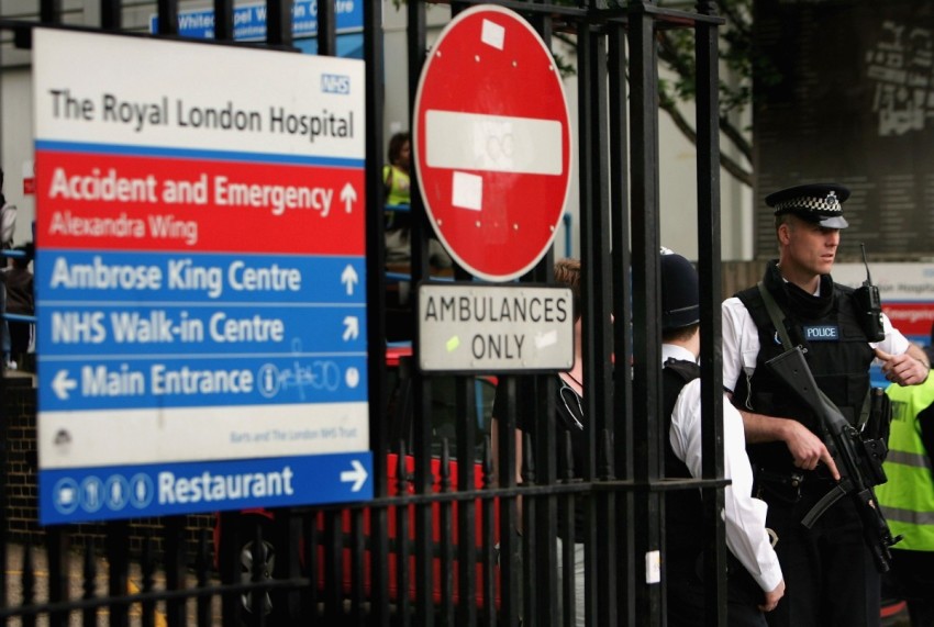 A British police officer stands guard at the entrance of the Royal London Hospital on June 2, 2006 in London, England. 
