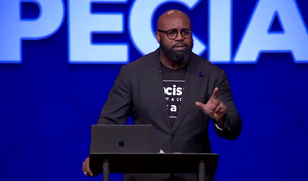 Pastor John Amanchukwu, a former football player for North Carolina University, speaks at Cornerstone Chapel in Leesburg, Virginia, on Aug. 17, 2022.