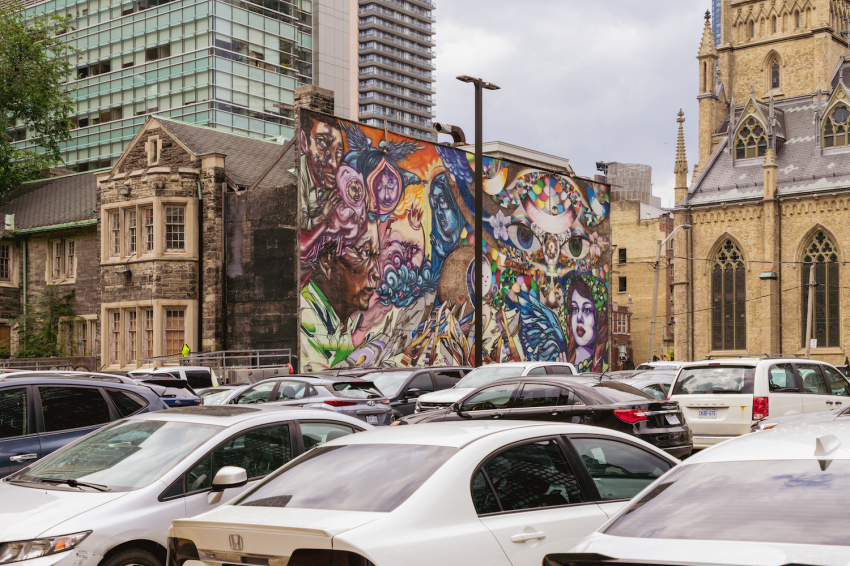The precincts of St. Michael’s Cathedral Basilica (Roman Catholic) are surrounded by towers and parking lots.
