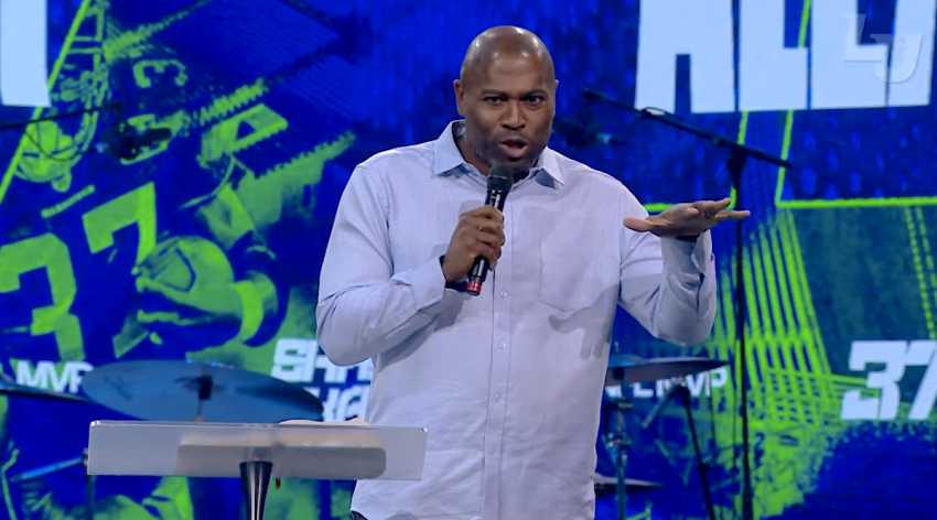 Former NFL MVP Shaun Alexander speaks during a convocation ceremony at Liberty University in Lynchburg, Virginia, on Sept. 2, 2022.