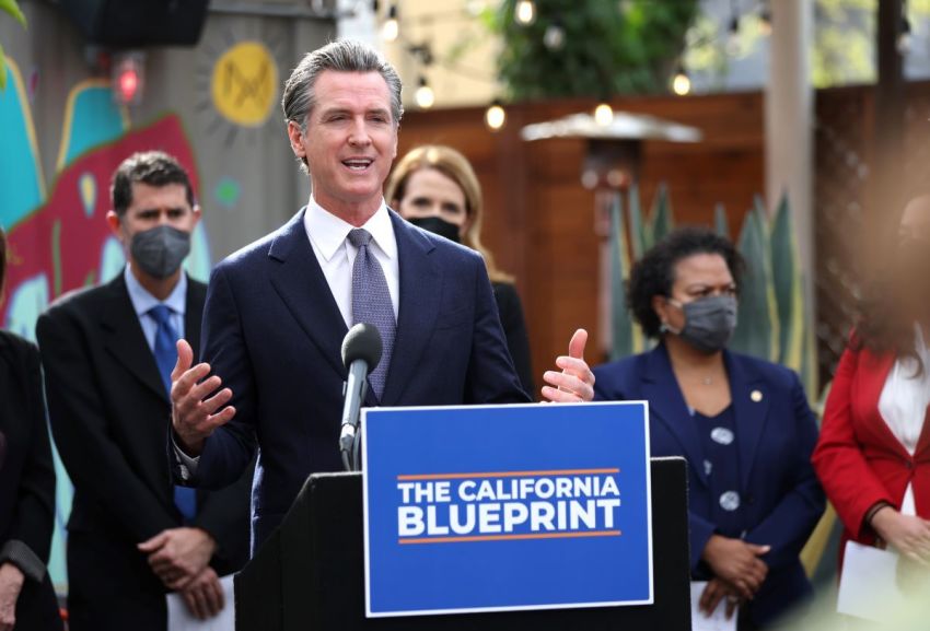 California Gov. Gavin Newsom speaks during a bill signing ceremony at Nido's Backyard Mexican Restaurant on Feb. 9, 2022, in San Francisco, California.
