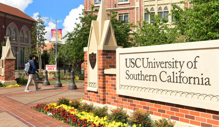 A student walks on campus at the University of Southern California in Los Angeles, California.