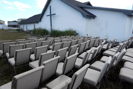 Chairs sit outside of the Garden City Chapel and Retreat after the church was flooded during Hurricane Ian on Oct. 1, 2022, in Garden City Beach, South Carolina. Ian hit Florida as a category 4 storm causing widespread damage as it crossed the state before moving into the Atlantic and then hitting South Carolina as a category 1 storm near Pawleys Island.