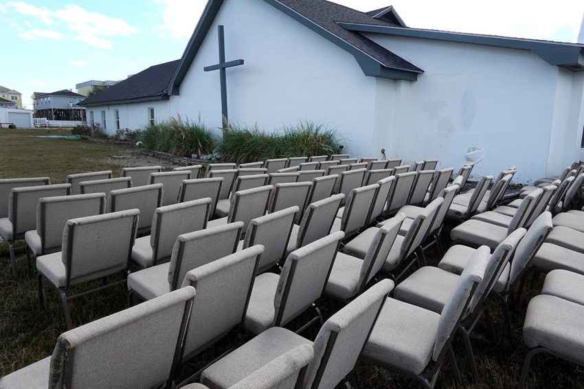 Chairs sit outside of the Garden City Chapel and Retreat after the church was flooded during Hurricane Ian on Oct. 1, 2022, in Garden City Beach, South Carolina. Ian hit Florida as a category 4 storm causing widespread damage as it crossed the state before moving into the Atlantic and then hitting South Carolina as a category 1 storm near Pawleys Island.