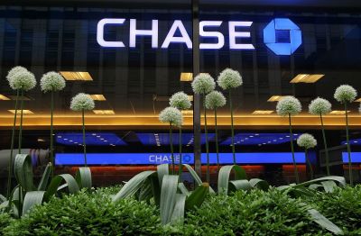 Flowers stand in front of a Chase sign at a bank branch inside the JPMorgan Chase headquarters on May 14, 2012 in New York City. Following a $2 billion trading blunder, JPMorgan Chase's chief investment officer Ina Drew retired and will be succeeded by Matt Zames, an executive from JPMorgan's investment bank. At least two others are also being held accountable for the mistake.