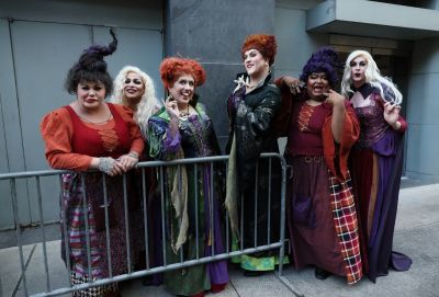 Guests in cosplay wait to enter the premiere for Disney's