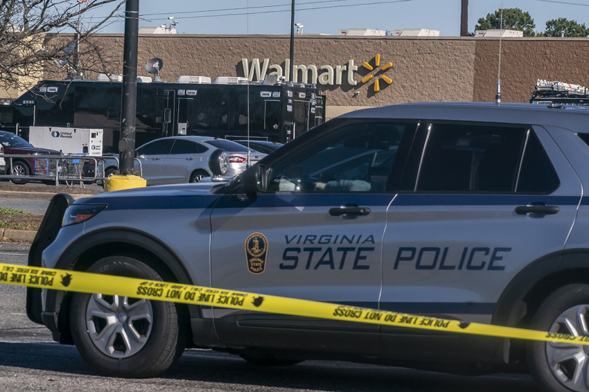 A police tape is seen at the site of a fatal shooting in a Walmart on Nov. 23, 2022, in Chesapeake, Virginia. Following the Tuesday night shooting, six people were killed, including the suspected gunman.