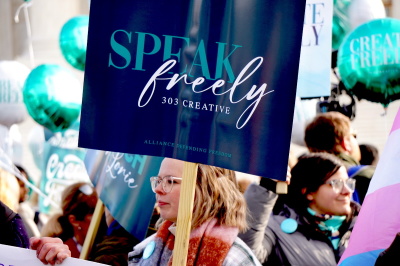 While Lorie Smith owner of 303 Creative in Colorado was having her Case heard at the Supreme Court level, demonstrators lined the front of the building to show their support.