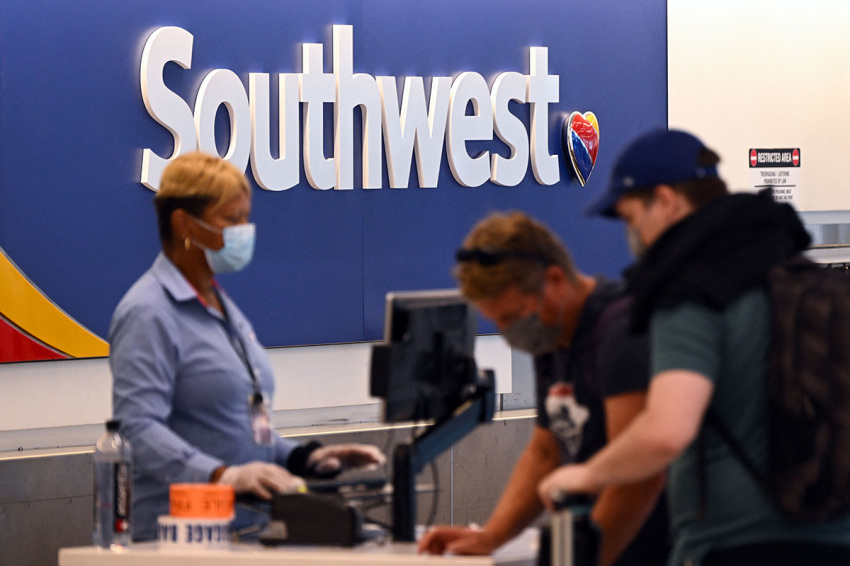 Passengers check in for a Southwest Airlines Co. flight inside Terminal 1 at Los Angeles International Airport (LAX) in Los Angeles, California, on Aug. 10, 2022.