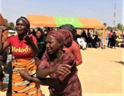 Mourners at a funeral for 40 Christians slain in Mallagum, Kaura County, southern Kaduna state, Nigeria, on Dec 22, 2022.
