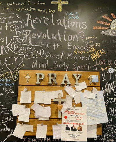 A prayer wall on display at Revelations Cafe in Tampa, Florida.