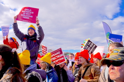 A pro-lifer holds a sign in the air at the March for life 2023 event which states: "Child Sacrifice is Not Welcome Here." The march took place on Jan. 20 in Washington DC.