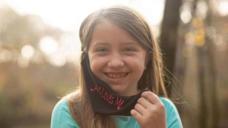 Lydia Booth was forced by her public school to remove her "Jesus Loves Me" face mask.
