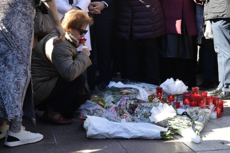 Relatives and friends of the victim react during a minute of silence near the church where a sacristan (priest's assistant) was killed the day before on Alta square in Algeciras, southern Spain, on January 26, 2023. - Spain opened a terror probe on January 25 after a man wielding a bladed weapon stormed a church in southern Spain, killing a sacristan and wounding severely a priest, legal sources told AFP. 