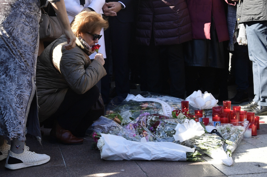 Relatives and friends of the victim react during a minute of silence near the church where a sacristan (priest's assistant) was killed the day before on Alta square in Algeciras, southern Spain, on January 26, 2023. - Spain opened a terror probe on January 25 after a man wielding a bladed weapon stormed a church in southern Spain, killing a sacristan and wounding severely a priest, legal sources told AFP.