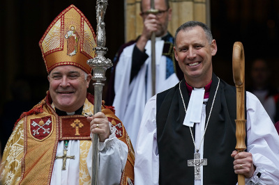 The Archbishop of York, Stephen Cottrell (L) stands next to The Rev. Canon Stephen Race (R).