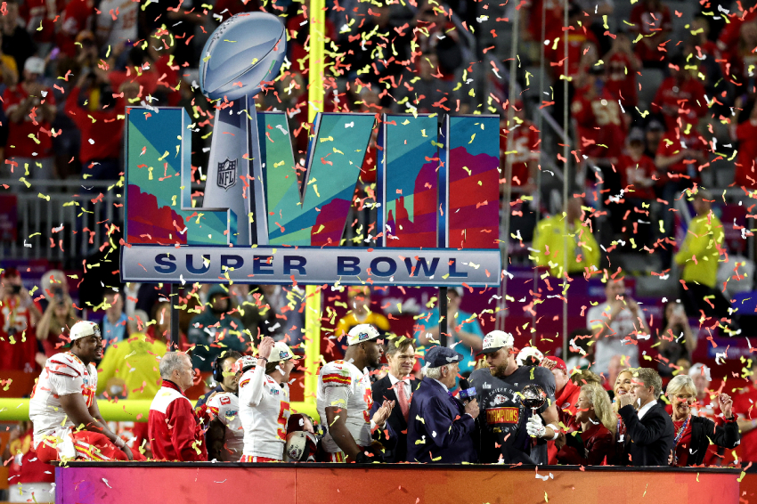 Travis Kelce #87 of the Kansas City Chiefs celebrates with the the Vince Lombardi Trophy after defeating the Philadelphia Eagles 38-35 in Super Bowl LVII at State Farm Stadium on February 12, 2023, in Glendale, Arizona.