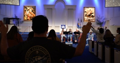 Students taking part in revival worship at the campus of Regent University of Virginia Beach, Virginia, during spring break, 2023.